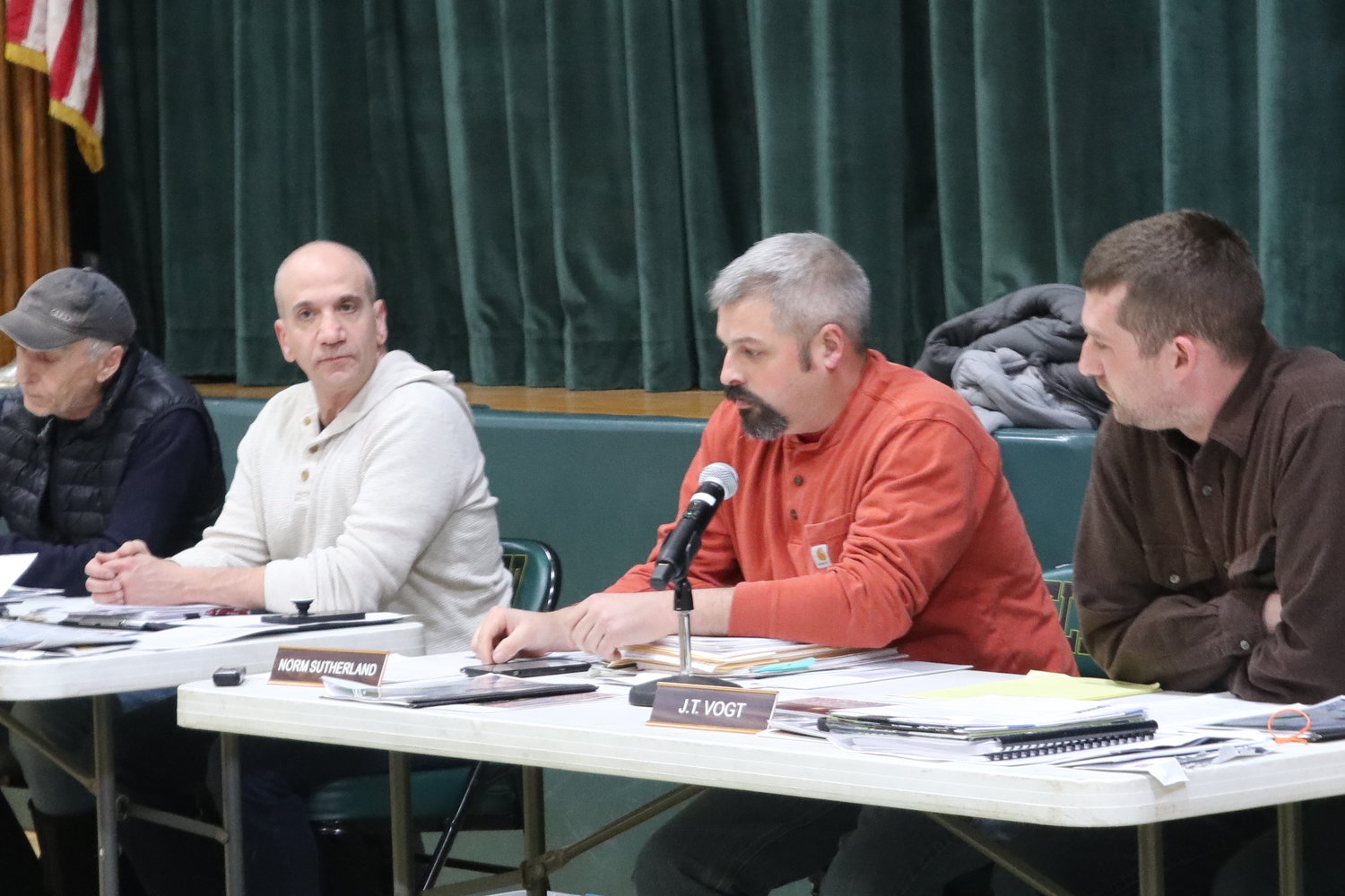 Planning board chairman Norm Sutherland, center, is flanked by member Jeff Spitz and vice chairman Jon Vogt at the meeting on Januar7 26 at the Eldred High School gymnasium.